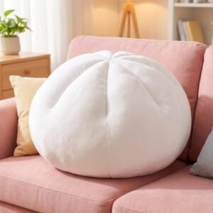 Giant dumpling squishy plush pillow on a cozy couch — Image 1 of 8