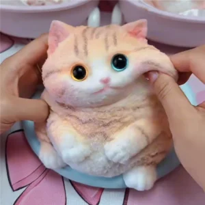 Kawaii cat squishy silicone stress toy on a desk — Image 1 of 7