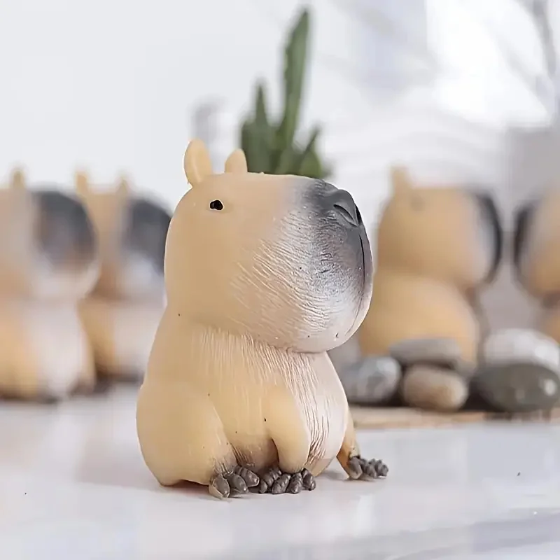 Soft capybara squishy toy squeezed in a hand — Image 3 of 7