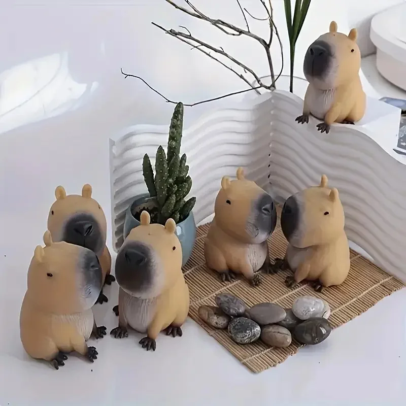 Soft capybara squishy toy squeezed in a hand — Image 5 of 7
